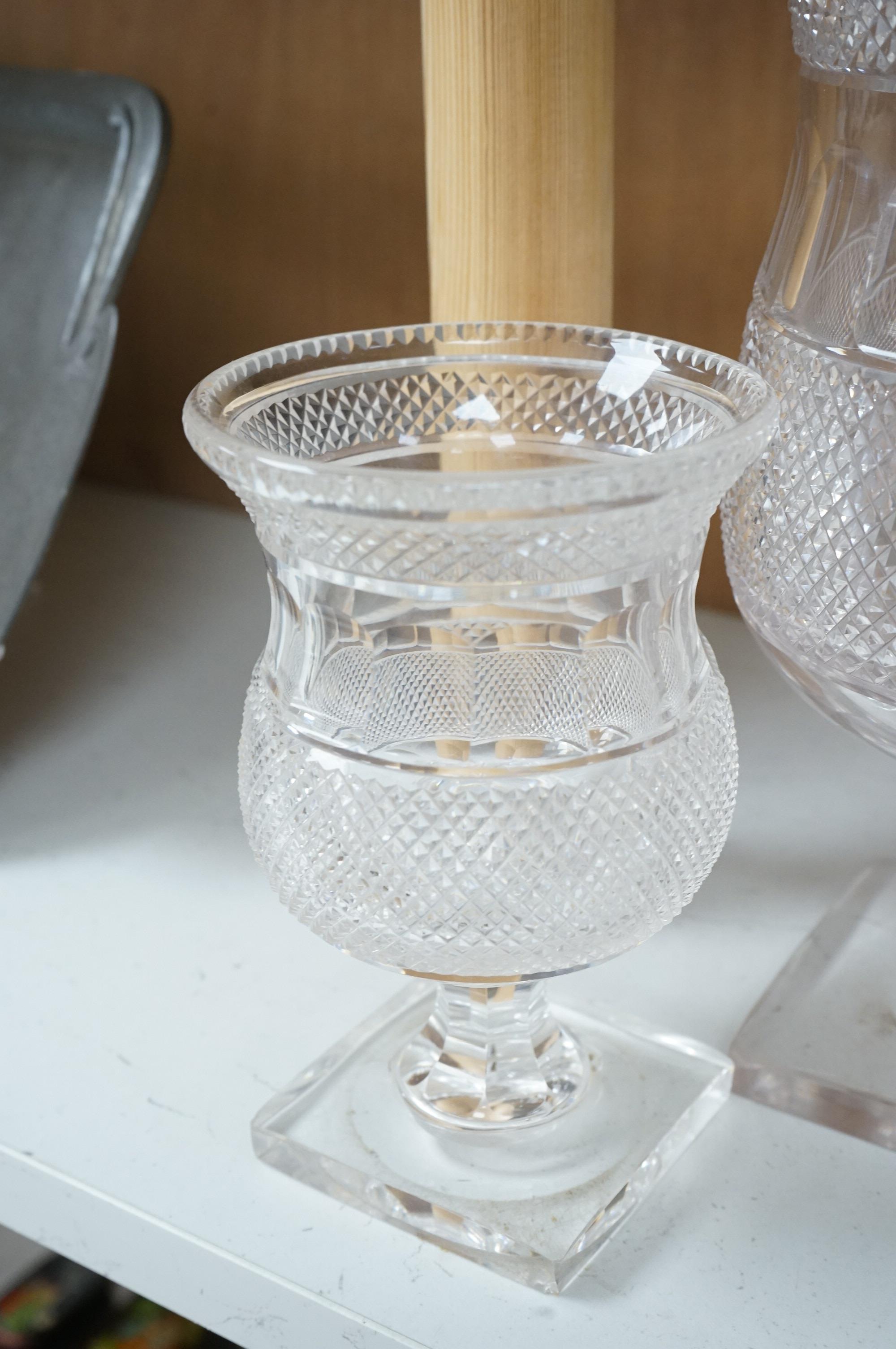 A garniture of three 19th century cut glass vases, largest 26cm high